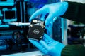 Closeup of technician repairing hard disk for data recovery in tech lab, symbolizing innovation, IT maintenance, and digital Royalty Free Stock Photo