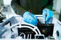 Closeup of technician repairing PC hardware using soldering tool in high-tech lab, representing technology maintenance, innovation Royalty Free Stock Photo