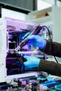Closeup of technician repairing PC hardware using soldering tool in high-tech lab, representing technology maintenance, innovation Royalty Free Stock Photo