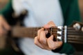 Closeup of Teen Boy& x27;s Hands Learning Chords on Guitar Indoors Royalty Free Stock Photo