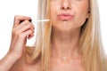 Closeup on teenage girl applying lip gloss Royalty Free Stock Photo