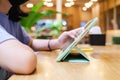 Girl using digital tablet in the cafe