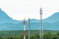 Telcommunication tower antenna with mountain background. Various of mobile telephone communication tower in forest Royalty Free Stock Photo