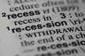 closeup of term and definition of recession printed in dictionary on white page.