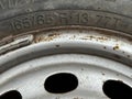 The text 165 65 showing width and aspect ratio of a tyre