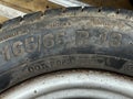 The text 165 65 showing width and aspect ratio of a tyre