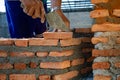 Closeup texture and background of orange bricklayers installed by worker at the construction site Royalty Free Stock Photo