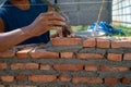 Closeup texture and background of orange bricklayers installed by worker at the construction site Royalty Free Stock Photo