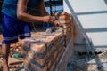 Closeup texture and background of orange bricklayers installed by worker at the construction site Royalty Free Stock Photo