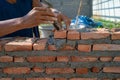 Closeup texture and background of orange bricklayers installed by worker at the construction site Royalty Free Stock Photo