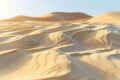 A closeup of the texture and pattern in sand ripples, with a beige color tone. the background is a vast expanse of light brow