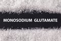 Closeup texture umami on dark background with text Monosodium glutamate . Sodium salt MSG, E621 used as flavor enhancer. Food Royalty Free Stock Photo