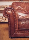 Closeup texture of vintage brown leather armchair in library Royalty Free Stock Photo