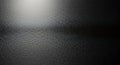 Closeup of a textured dark surface with a subtle light reflection across the middle Royalty Free Stock Photo
