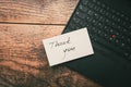 Closeup of Thank You sticky note message on laptop Royalty Free Stock Photo