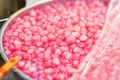 Closeup of Thapthim krop, mock pomegranate seeds in coconut and syrup, thai street food market