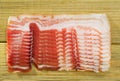 Slices of cured bacon