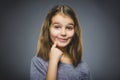 Closeup Thoughtful girl with Hand at head isolated on Gray