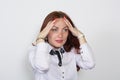 Closeup of a thoughtful red-haired woman with hands on forehead looking away isolated Royalty Free Stock Photo