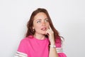 Closeup of a thoughtful red-haired woman looking away isolated on white background Royalty Free Stock Photo