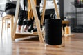 Closeup of a thread spool for macrame weaving on a wooden floor