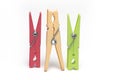 Closeup three colored clothespins hangers white background Royalty Free Stock Photo