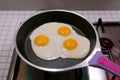 Closeup three of eggs being fried in a pan Royalty Free Stock Photo