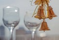 Closeup three golden Christmas bells hanging on the blurred back Royalty Free Stock Photo