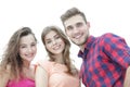 Closeup of three young people smiling on white background Royalty Free Stock Photo