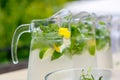 A closeup of three jugs with mohito drink