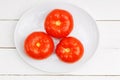 Closeup three red ripe wet tomatoes with water droplets Royalty Free Stock Photo