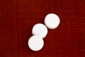 Closeup of three white pills Royalty Free Stock Photo
