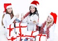 Closeup.three young women in hats of Santa Claus with Christmas Royalty Free Stock Photo