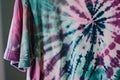 closeup of a tiedye tshirt on a hanger