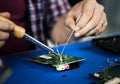 Closeup of tin soldering with electronics circuit board Royalty Free Stock Photo