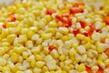 Closeup of tinned whole kernel corn and carrots