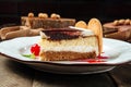 Closeup on tiramisu cake with berry sauce