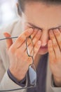 Closeup on tired business woman with eyeglasses Royalty Free Stock Photo