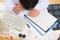 Closeup on tired medical doctor sleeping on table