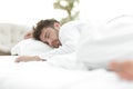 Closeup.the tired men sleep soundly on the bed Royalty Free Stock Photo