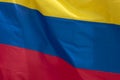 Closeup to a Colombian flag waving with the wind Royalty Free Stock Photo