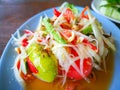 Closeup to Famous Thai food, papaya salad or SOM TAM or Somtum. in plate. Royalty Free Stock Photo