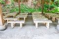 Closeup to Many Dirty Cement Benches in Cemetery Royalty Free Stock Photo