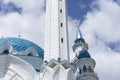 Closeup to a minaret and little domes of exterior facade of kazan kremlin