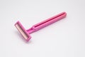 Closeup to Old Dirty Used Pink Twin Blades Razor, Isolated