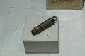 Closeup to and old silver colombian police whistle