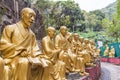 Closeup to rows of Buddhas on the path leading up to Ten Thousand Buddhas Monastery