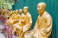 Closeup to rows of Buddhas on the path leading up to Ten Thousand Buddhas Monastery