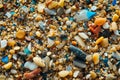 Closeup to sea ocean beach sand with micro plastics. Environment, pollution, plastic waste concept Royalty Free Stock Photo