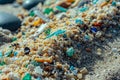 Closeup to sea ocean beach sand with micro plastics. Environment, pollution, plastic waste concept Royalty Free Stock Photo